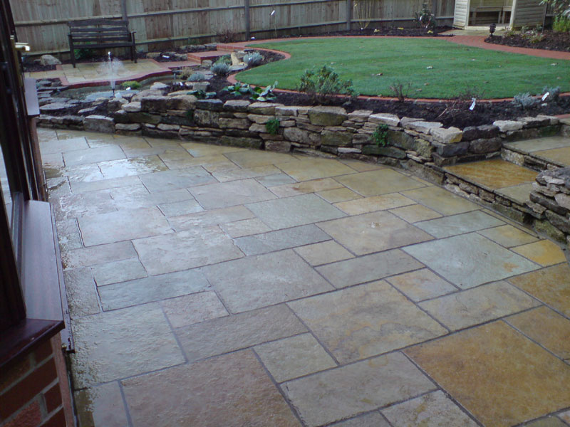 A garden rebuilt following the customers original design many years previously. The stone for the retaining walls was recovered from the original construction.