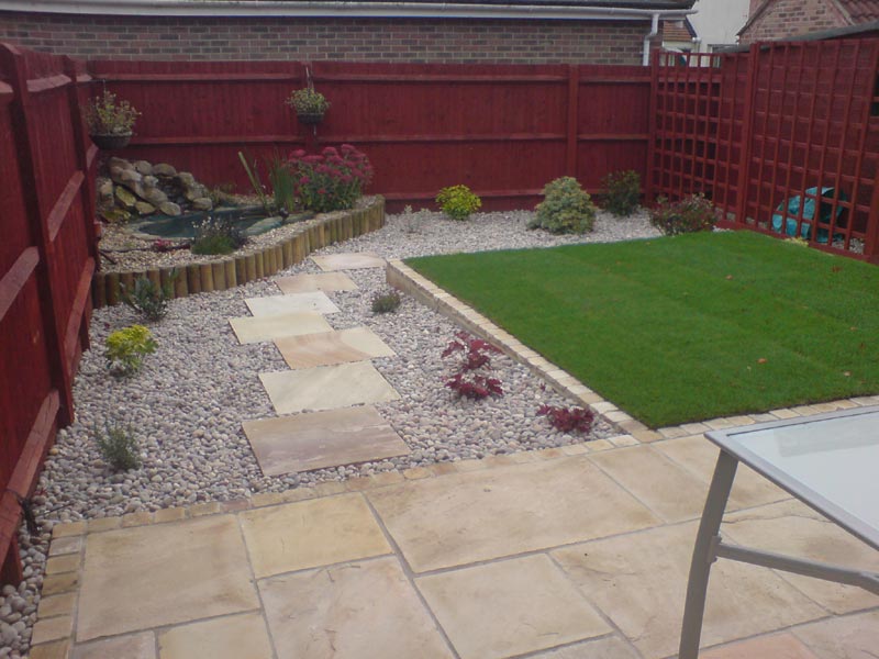 A small garden makeover with new paving, level lawn, gravel and planting to compliment the existing water feature in the far left corner.