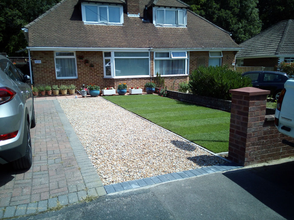 A front garden with extended gravel drive and new lawn