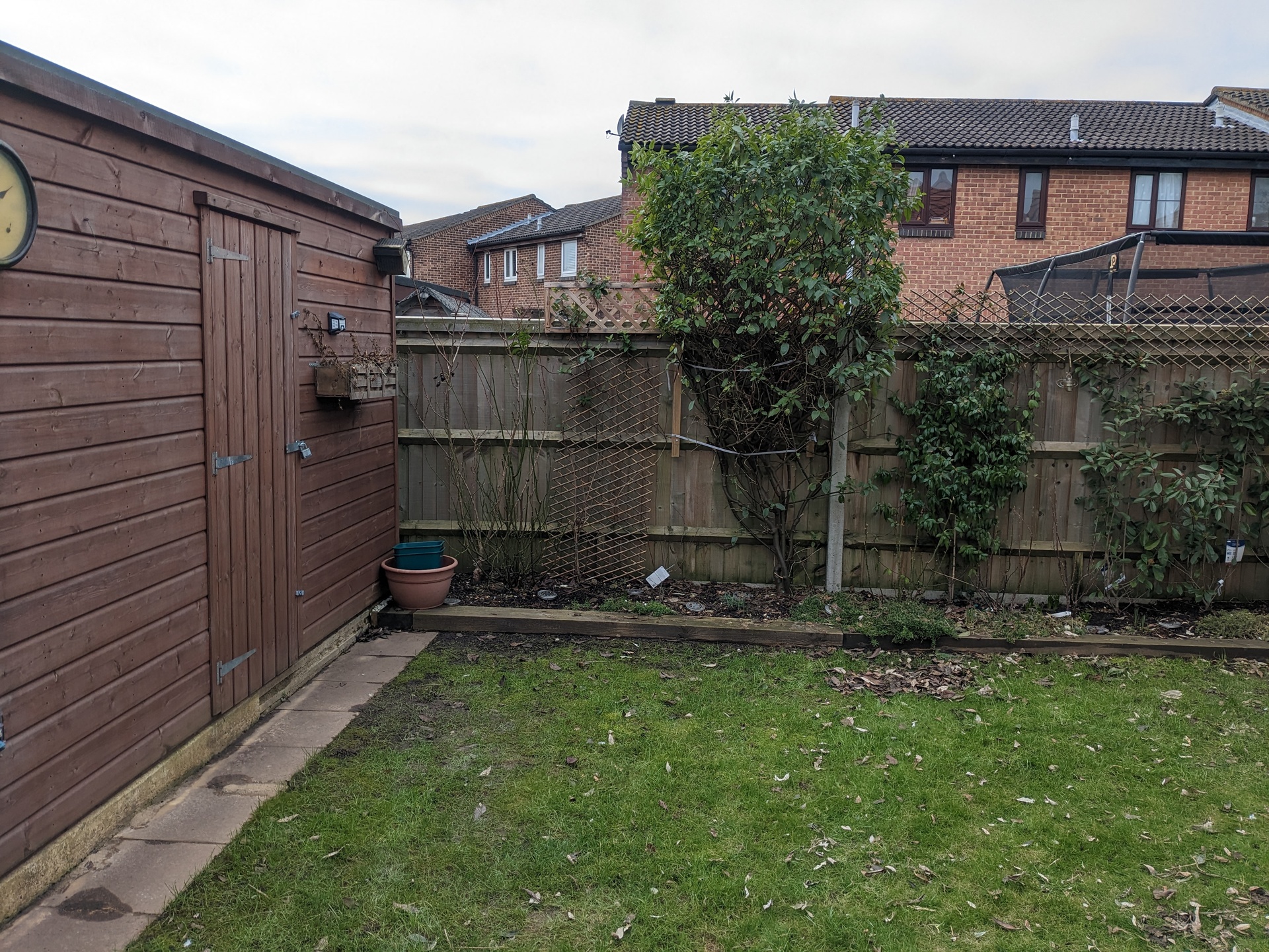 Garden makeover in Park Gate with new patio, brick edging, sleepers and artificial grass