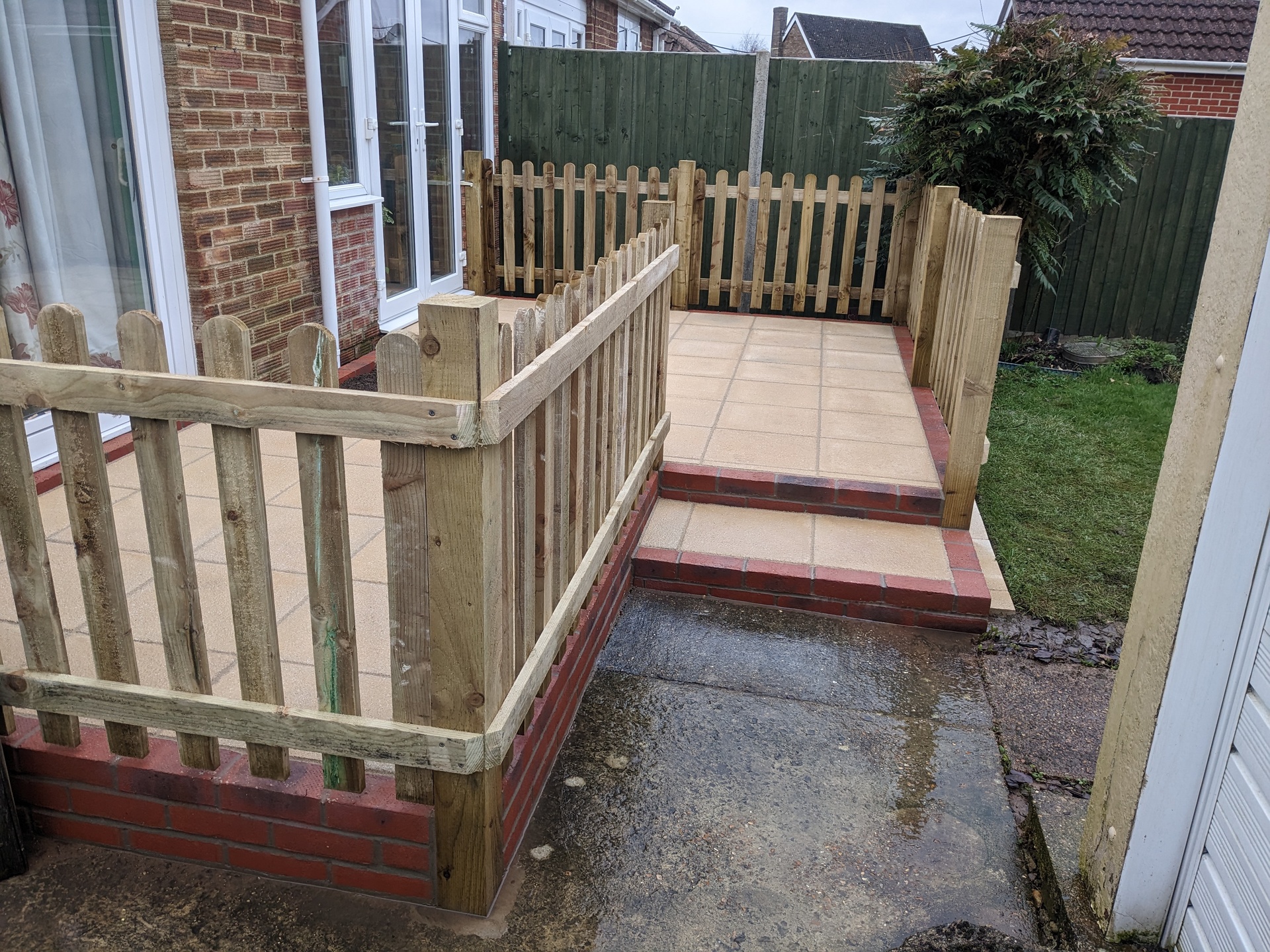 Small raised patio with balustrade and steps