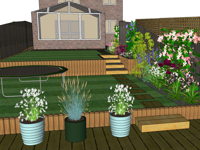 A gently sloping garden is designed with terracing to provide level areas of lawn for young children to play on. 